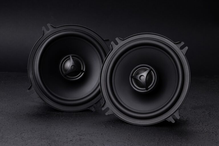 Car audio speakers on dark background